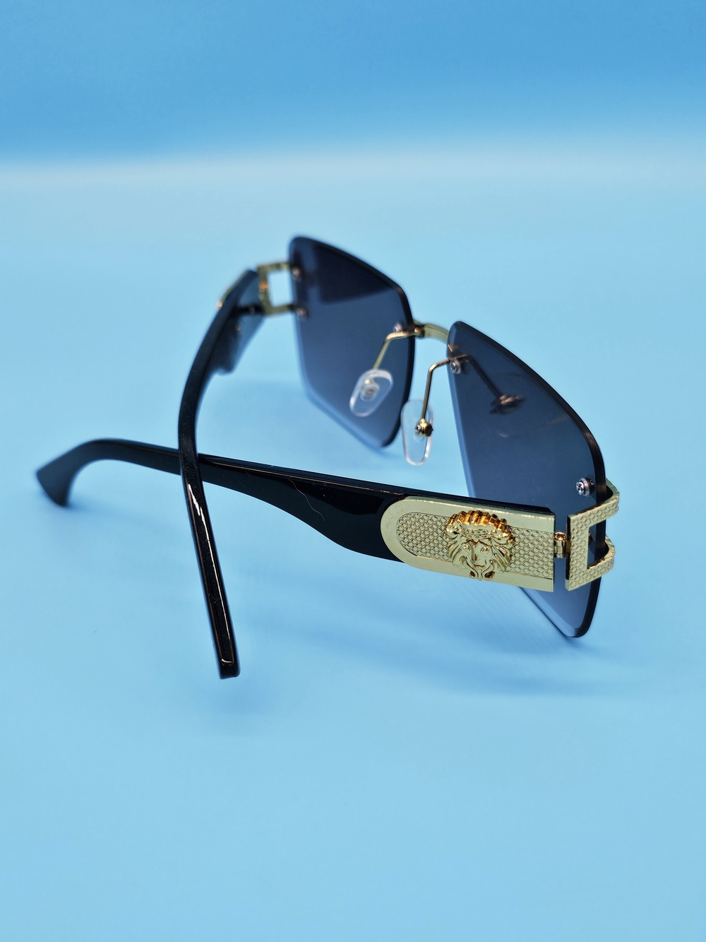 Gold-Trim Black Sunglasses with Dark Lenses